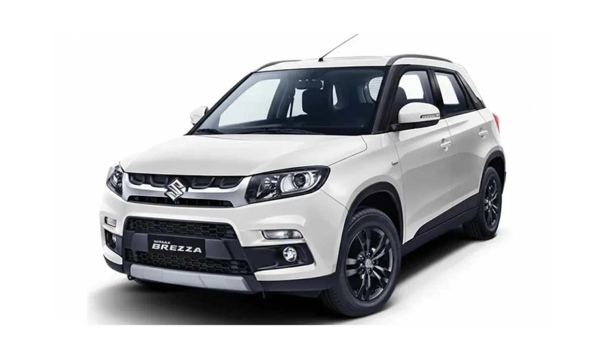 Image Alt Text: 2026 Maruti Brezza facelift prototype showing underbody CNG tank during road testing