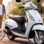 Suzuki e-Access electric scooter parked on city road with rider charging