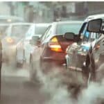 BS7 India 2026 emission norms feature image with cars and city skyline.