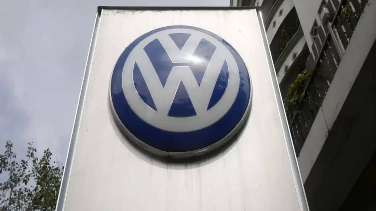 Volkswagen electric vehicle concept with Indian manufacturing facility in background indicating local BEV assembly plans