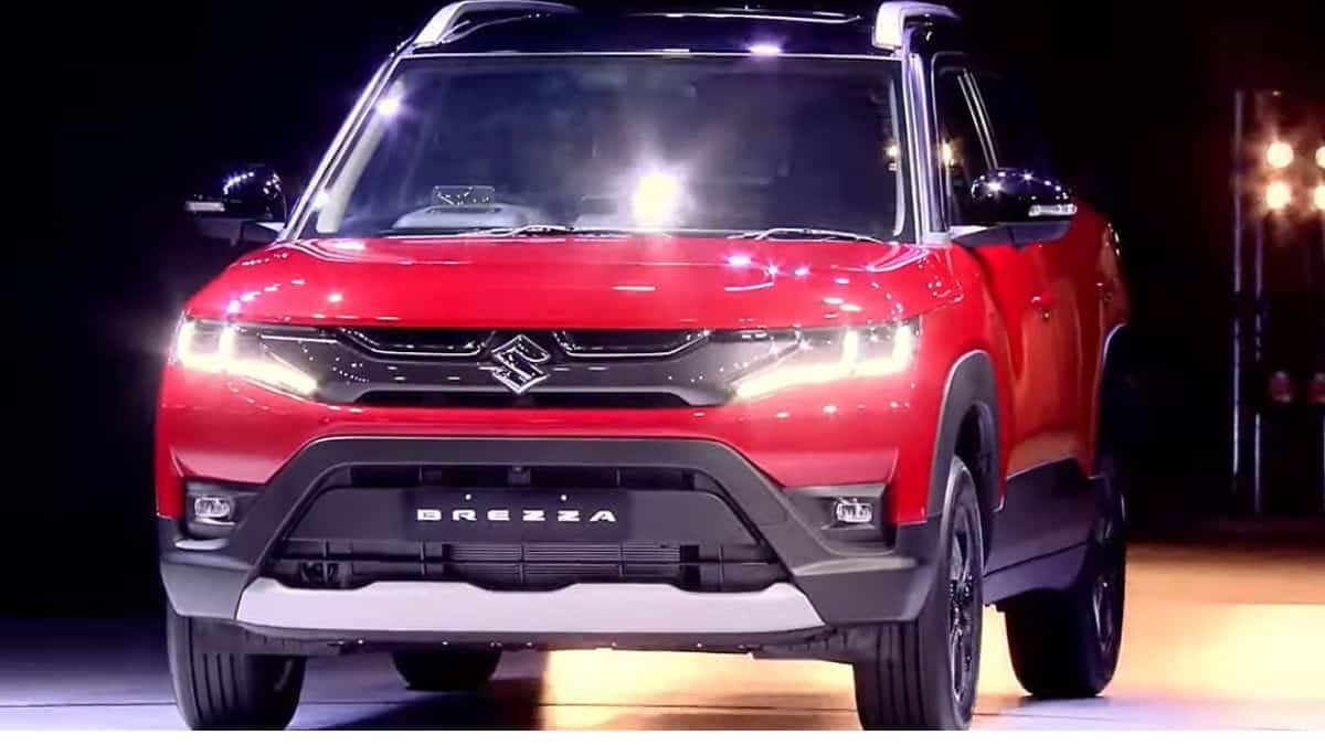 Maruti Suzuki Brezza compact SUV displayed at dealership marking 10-year milestone in India