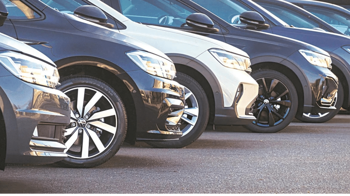 Passenger vehicles lined up at an Indian car dealership during record retail sales in February 2026