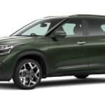 Kia Seltos SUV driving on Indian road showcasing modern design, LED headlights, premium interior and compact SUV styling