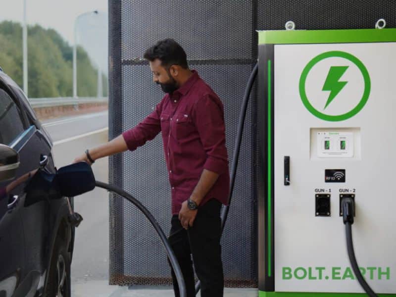 Electric vehicle connected to a DC fast charging station at a public charging point