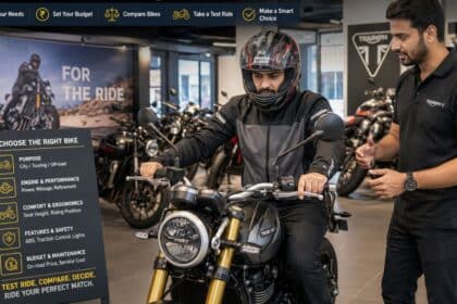 A prospective buyer inspecting a motorcycle at an Indian dealership showroom