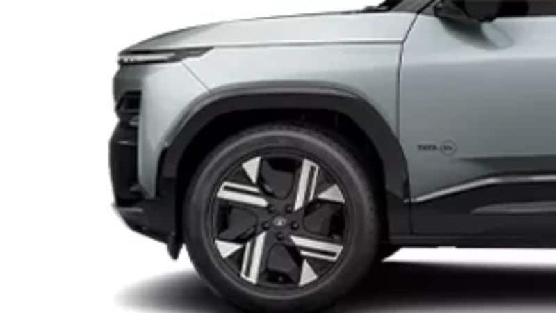 Tata Sierra EV side profile showing dual-tone alloy wheels and boxy silhouette