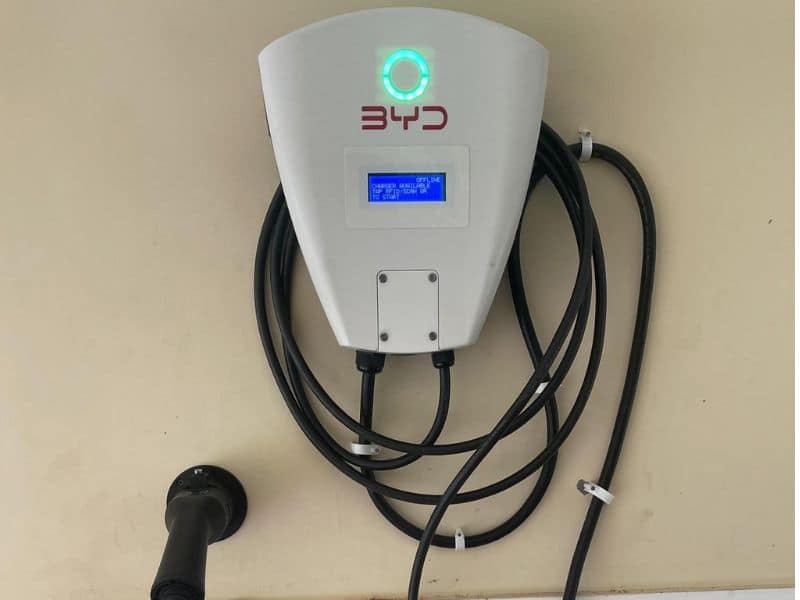 Wall-mounted EV charger installed in a home parking spot in India