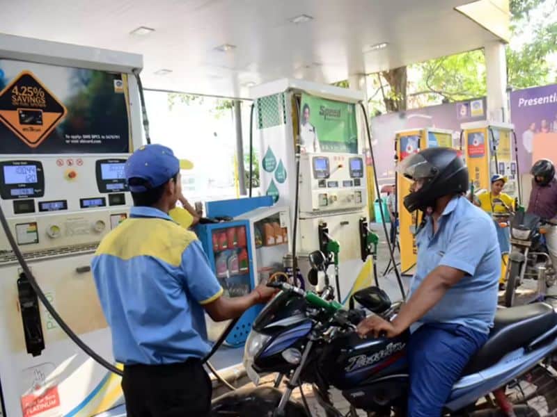 Petrol motorcycle refueling at an Indian fuel station