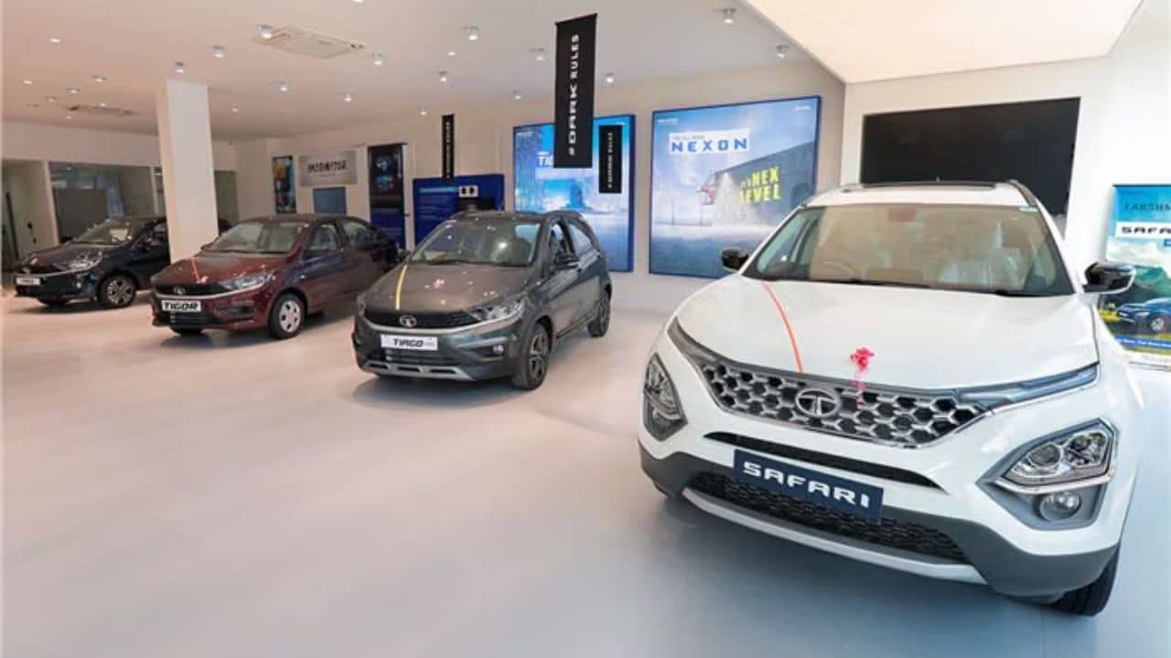 Row of new SUVs and hatchbacks parked at an Indian car dealership showroom, representing July 2026 passenger vehicle sales.