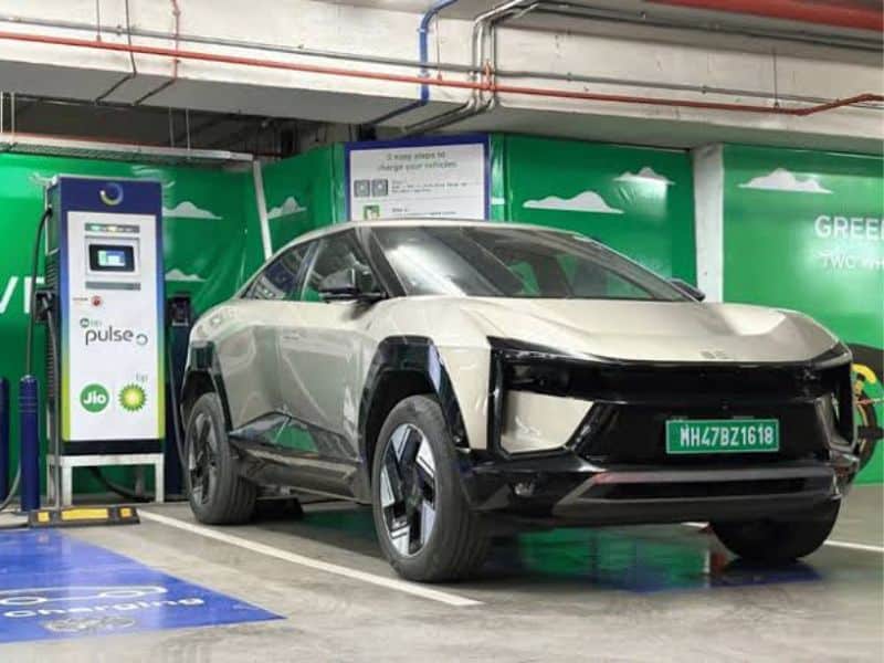 Mahindra BE 6 electric SUV connected to a DC fast charger in India