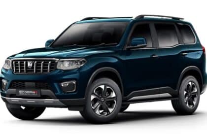 Row of Mahindra SUVs parked at an Indian dealership showroom, representing wholesale dispatch and retail stock.