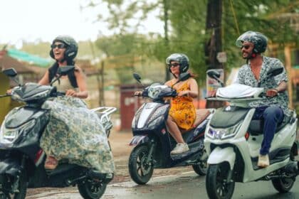 Scooter rider navigating a street in a Tier-2 Indian town, reflecting rising two-wheeler demand outside major metros.