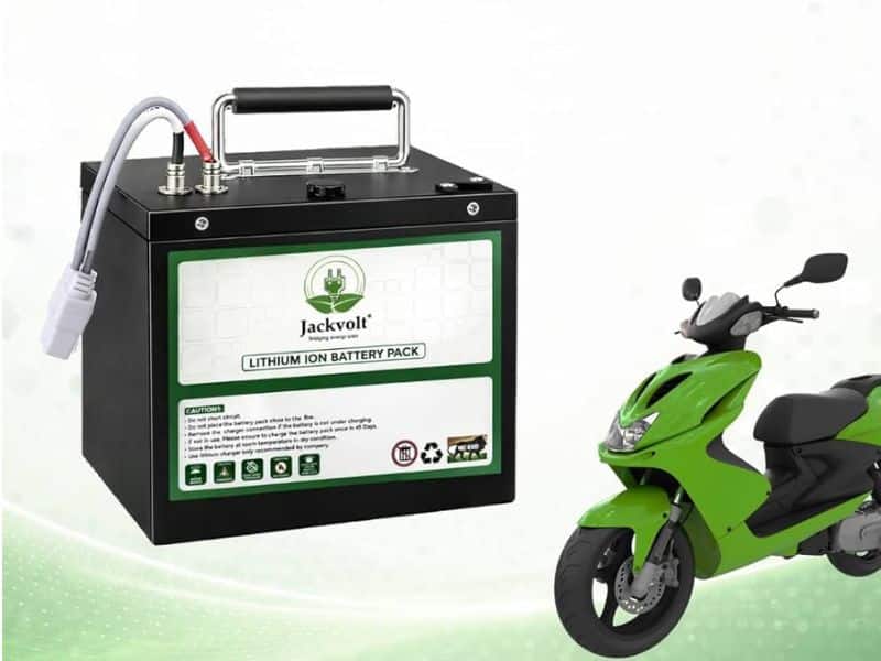 Close-up of an electric scooter battery pack being inspected at a service center